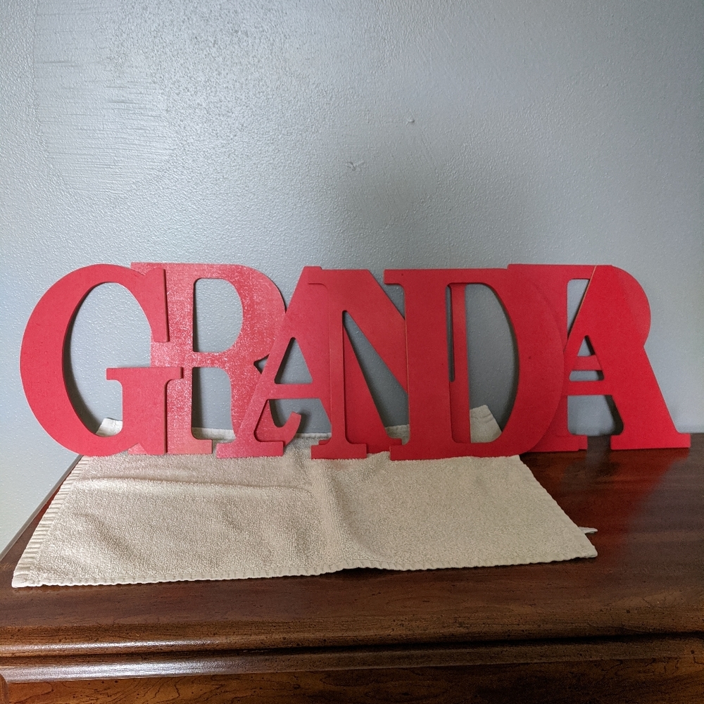 Red letters spelling GRANDPA for photos/gifts